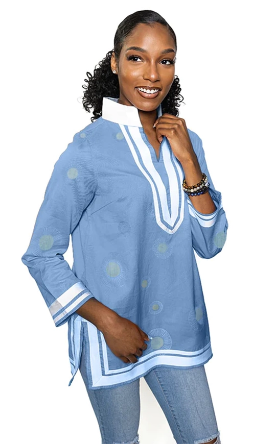 lt blue; tunic with white trim & collar.  Gold circles