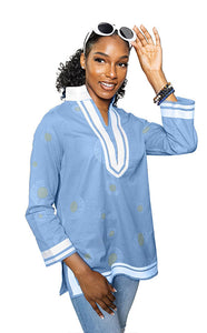 lt blue; tunic with white trim & collar.  Gold circles